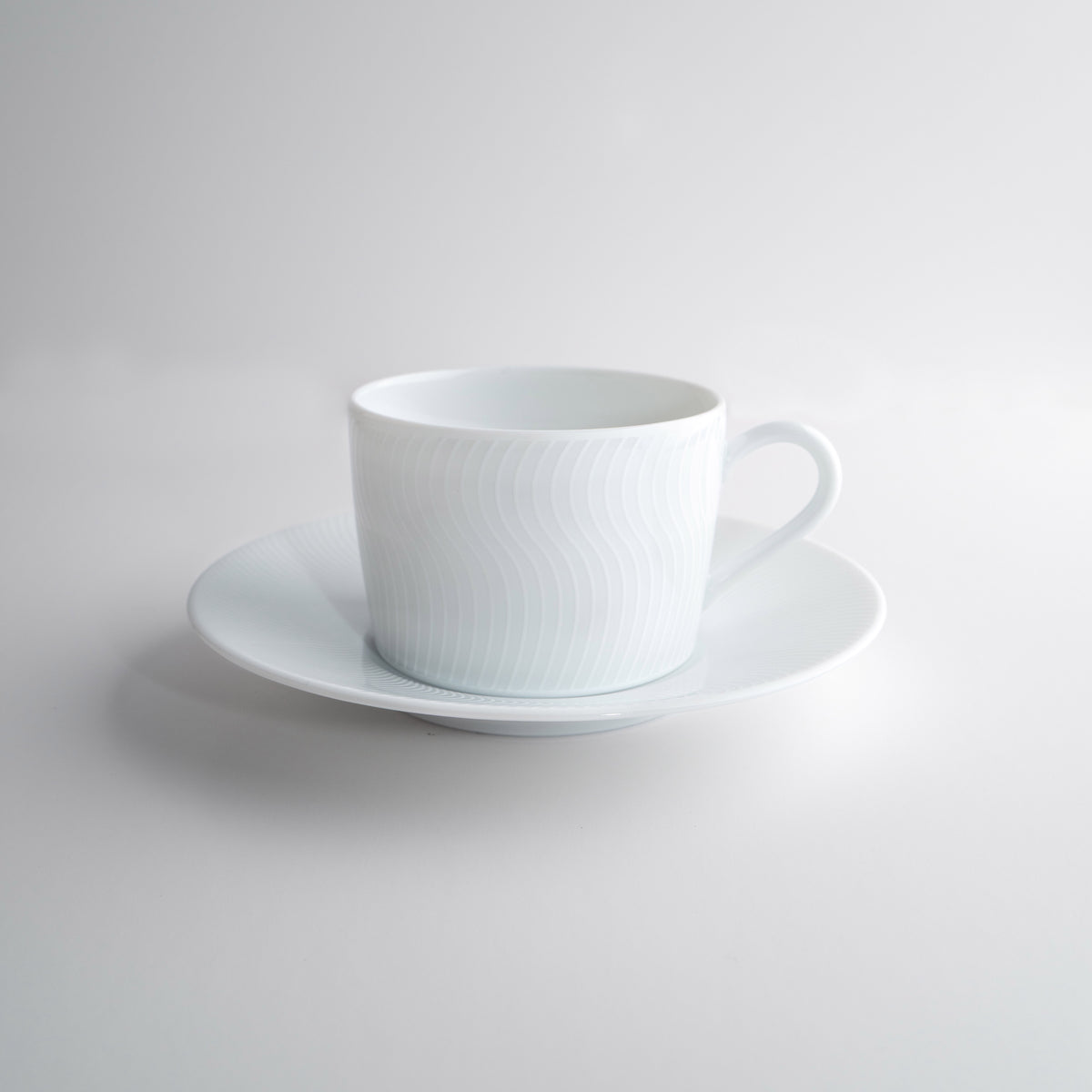 Tasse à thé avec la soucoupe - Illusion Blanche