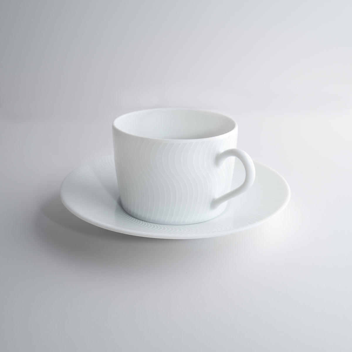 Tasse à thé avec la soucoupe - Illusion Blanche